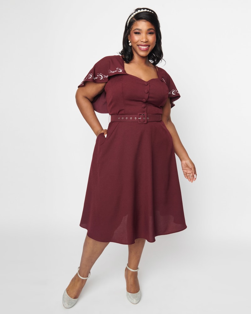 Front of a model wearing a size 4X Unique Vintage Eggplant & Moon Embroidered Capelet Swing Dress in Purple by Unique Vintage. | dia_product_style_image_id:300541